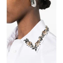 Camicia con decorazioni floreali