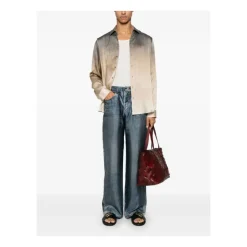 Pantaloni blu con zip e stampa trompe l`oeil