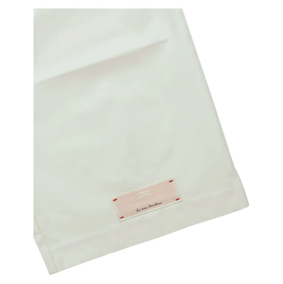 Pantaloni color burro a vita alta e svasati